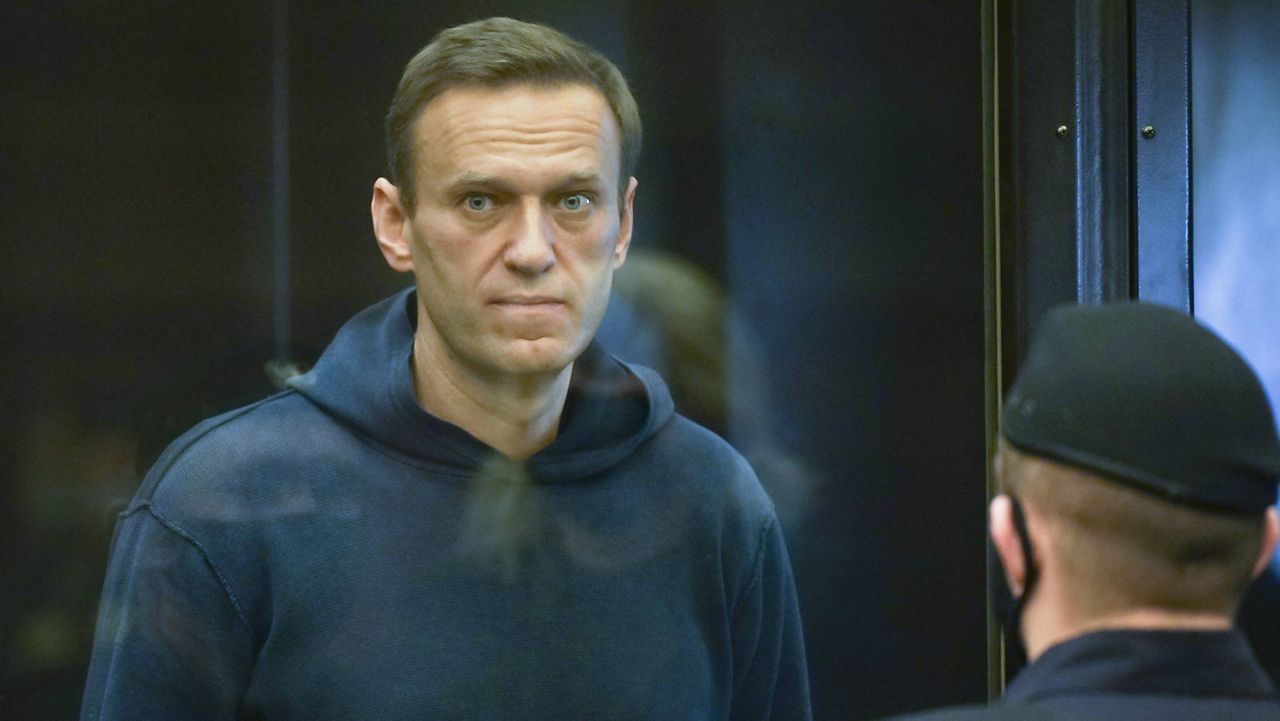 In this handout photo provided by Moscow City Court Russian opposition leader Alexei Navalny stands in the cage during a hearing at the Moscow City Court in Moscow, Russia, Tuesday, Feb. 2, 2021. (Moscow City Court via AP)