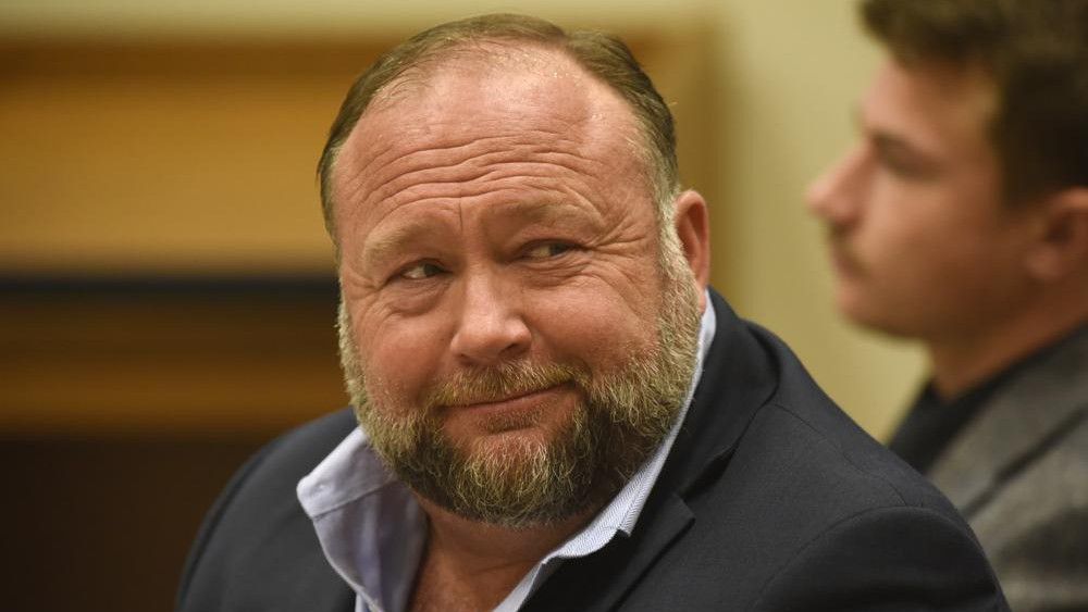 Infowars founder Alex Jones appears in court to testify during the Sandy Hook defamation damages trial at Connecticut Superior Court in Waterbury, Conn. Thursday, Sept. 22, 2022. Jones was found liable last year by default for damages to plaintiffs without a trial, as punishment for what the judge called his repeated failures to turn over documents to their lawyers. The six-member jury is now deciding how much Jones and Free Speech Systems, Infowars’ parent company, should pay the families for defaming them and intentionally inflicting emotional distress. (Tyler Sizemore/Hearst Connecticut Media via AP, Pool)