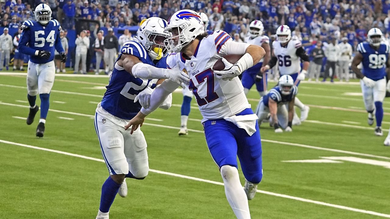 Buffalo Bills quarterback Josh Allen (17) runs for a touchdown with Indianapolis Colts safety Nick Cross (20) defending during the first half of an NFL football game, Sunday, Nov. 10, 2024, in Indianapolis. (AP Photo/Darron Cummings)