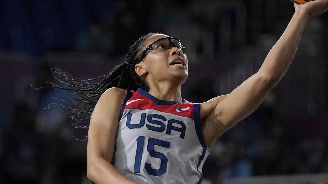 United States' Allisha Gray (15) heads to the basket past Evgeniia Frolkina, of the Russian Olympic Committee, during a women's 3-on-3 gold medal basketball game at the 2020 Summer Olympics, Wednesday, July 28, 2021, in Tokyo, Japan. (AP Photo/Jeff Roberson)