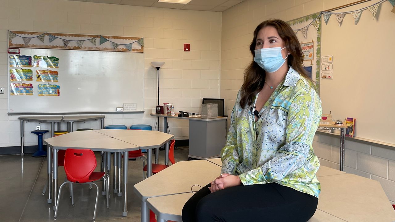 3rd grade teacher Allison Shockley puts the final touches on her new classroom (Spectrum News 1/Mason Brighton)