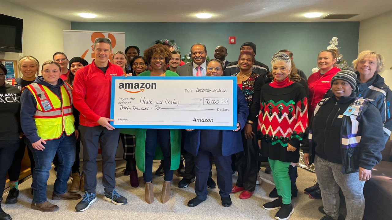 Amazon and Battered Women’s Shelter employees gathered for the presentation. (Photo courtesy of Amazon)