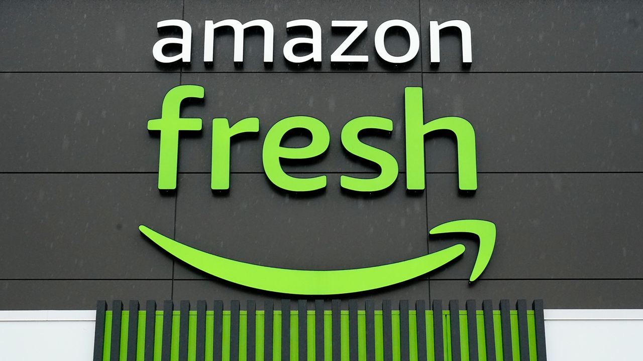 An Amazon Fresh grocery store stands in Warrington, Pa., on Feb. 4, 2022. In an email to Prime members Friday, Jan. 27, 2023, Amazon said that they are axing free grocery delivery for Prime members on orders less than $150. (AP Photo/Matt Rourke, File)