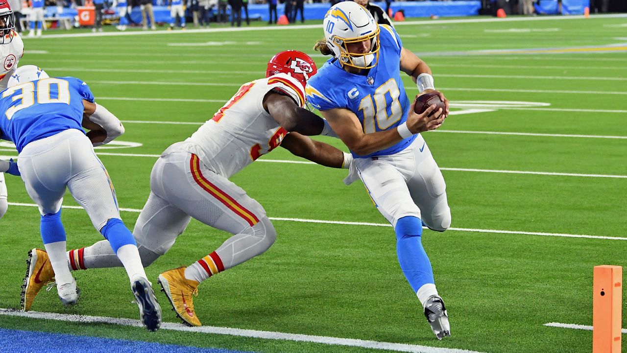 Los Angeles Chargers quarterback Justin Herbert (10) runs for a touchdown in the first half of an NFL football game against the Kansas City Chiefs, Thursday, December 16, 2021 in Inglewood, Calif. (John Cordes/AP Images for Panini)