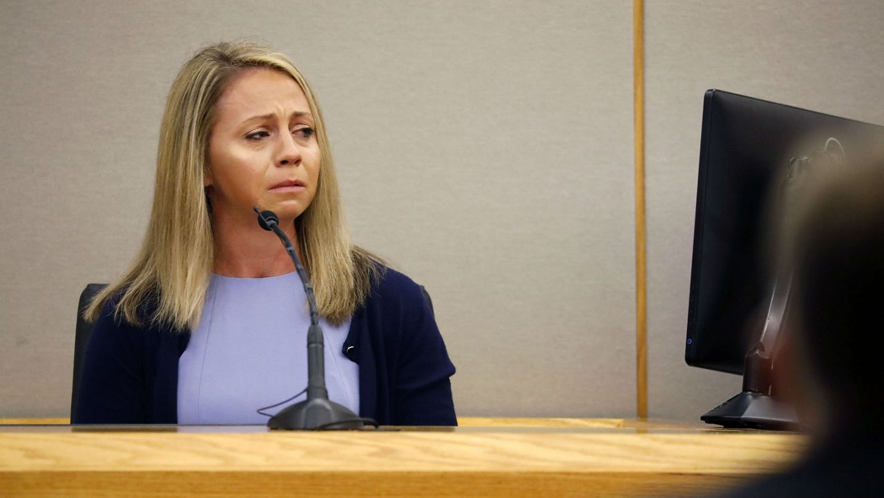 Fired Dallas police officer Amber Guyger becomes emotional as she testifies in her murder trial, Friday, Sept. 27, 2019, in Dallas. Guyger is accused of shooting and killing Botham Jean, an unarmed 26-year-old neighbor in his own apartment last year. She told police she thought his apartment was her own and that he was an intruder. (Tom Fox/The Dallas Morning News via AP, Pool)