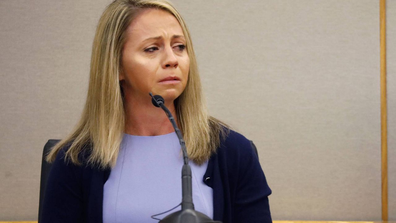 FILE - In this Sept. 27, 2019, file photo, fired Dallas police officer Amber Guyger becomes emotional as she testifies in her murder trial in Dallas. A federal judge has ruled the city of Dallas is not liable for the off-duty police officer fatally shooting a man in his own apartment last year. On Monday, Dec. 23, 2019 U.S. District Judge Barbara Lynn dismissed the city from civil lawsuit that the family of Botham Jean brought after the 26-year-old was killed by Guyger. (Tom Fox/The Dallas Morning News via AP, Pool, File)