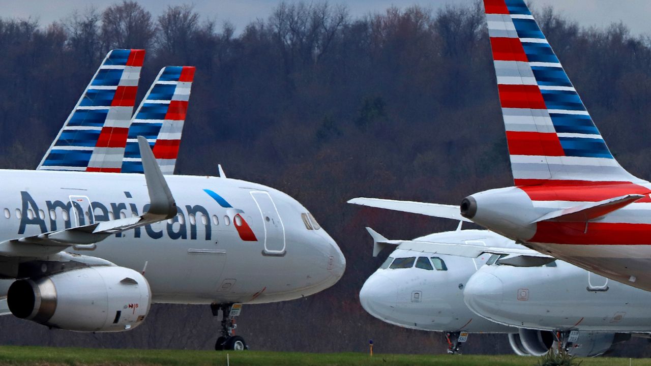 In this March 31, 2020 file photo American Airlines planes are parked at Pittsburgh International Airport in Imperial, Pa. Shares of American Airlines are falling on word from the carrier that first-quarter profit could be below Wall Street expectations. American said Wednesday, April 12, 2023 that it expects to earn between a penny and 5 cents per share for the quarter that just ended. That leaves room for American to fall short of analysts' prediction that the airline would earn 5 cents per share. (AP Photo/Gene J. Puskar)