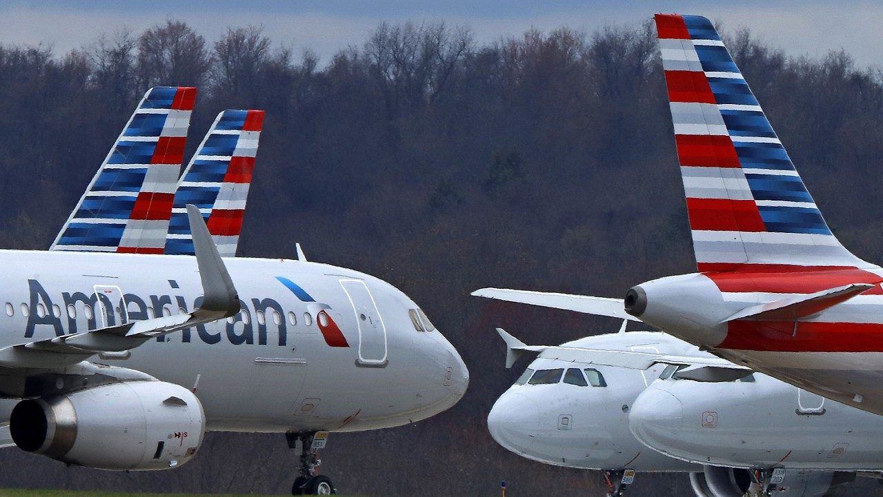 American Airlines planes sit stored at Pittsburgh International Airport on March 31, 2020, in Imperial, Pa. (AP Photo/Gene J. Puskar)