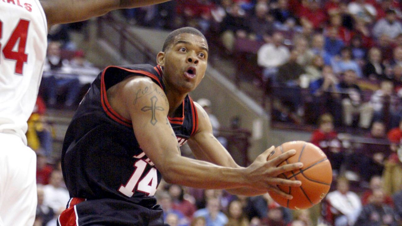 Texas Tech's Andre Emmett (14) tries to shoot around Ohio State's Terence Dials during the first half of an NCAA basketball game at Value City Arena in Columbus, Ohio, Jan. 4, 2004. A jury on Friday, Sept. 16, 2022 convicted Larry Daquan Jenkins, 25, of capital murder, in the killing of Emmett, the former Texas Tech basketball star. (AP Photo/Ron Schwane, File)