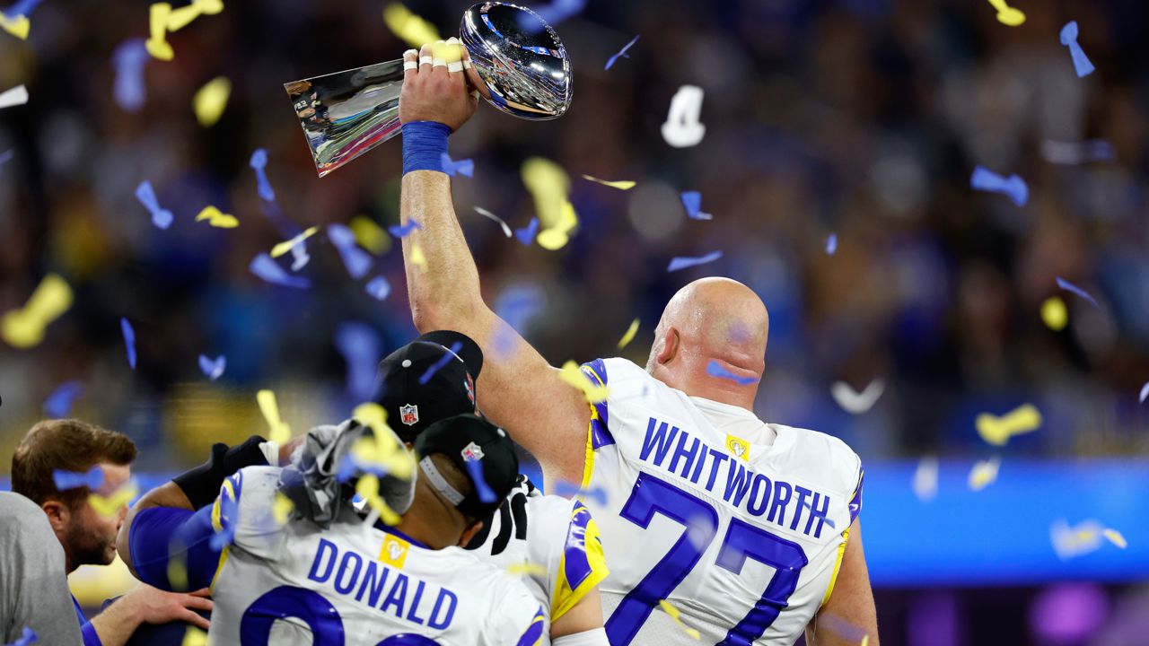 Los Angeles Rams offensive tackle Andrew Whitworth (77) celebrates after  winning the NFL Super Bowl 56 football game against the Cincinnati Bengals,  Sunday, Feb. 13, 2022 in Inglewood, CA. (AP Photo/Tyler Kaufman