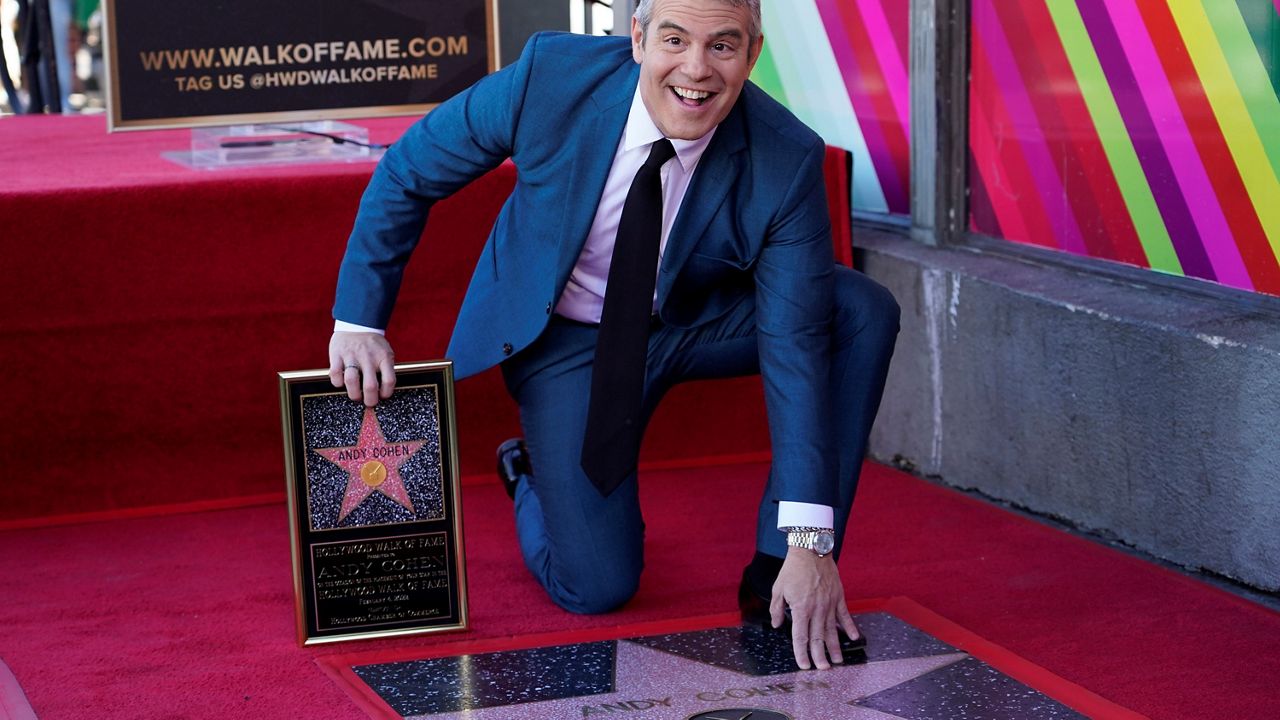 Talk show host Andy Cohen poses with his new star on the Hollywood Walk of Fame following a ceremony on Friday, Feb. 4, 2022, in Los Angeles. (AP Photo/Chris Pizzello)