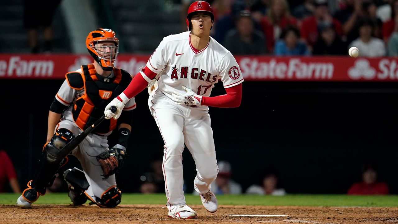 Los Angeles Angels' Shohei Ohtani reacts as he fouls off a pitch during the eighth inning of a baseball game against the San Francisco Giants Tuesday, June 22, 2021, in Anaheim, Calif. (AP Photo/Marcio Jose Sanchez)