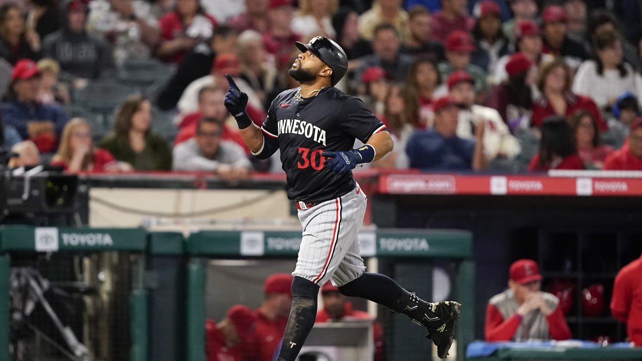 Minnesota Twins' Carlos Santana gestures while running the bases after hitting a three-run home run against the Los Angeles Angels during the fourth inning of a baseball game Saturday, April 27, 2024, in Anaheim, Calif. (AP Photo/Ryan Sun)