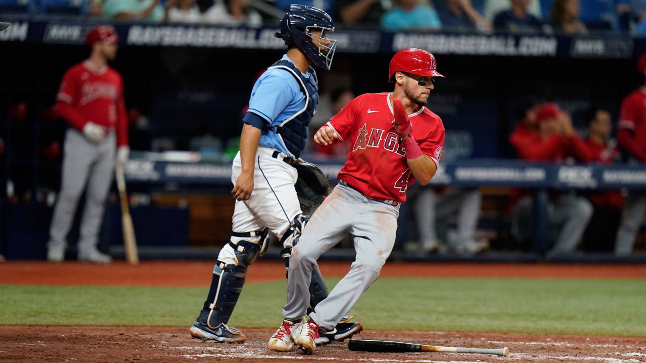 Los Angeles Angels' Andrew Velazquez (4) scores in front of Tampa Bay Rays catcher Francisco Mejia on an RBI single by Mike Trout during Monday’s game in St. Petersburg, Fla. (AP Photo/Chris O'Meara)