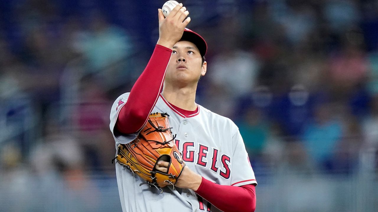 Los Angeles Angels starting pitcher Shohei Ohtani prepares to throw during the first inning of the team's baseball game against the Miami Marlins, Wednesday, July 6, 2022, in Miami. (AP Photo/Lynne Sladky)