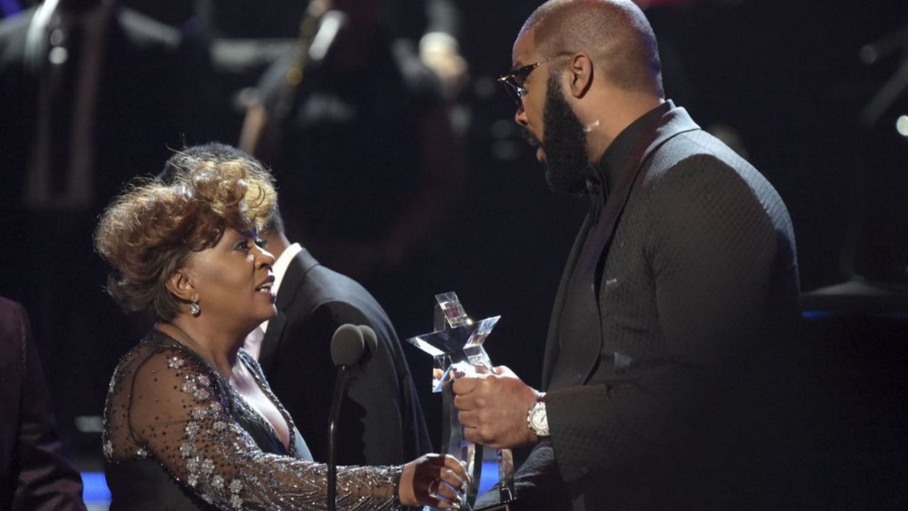 Tyler Perry, right, presents the lifetime achievement award to Anita Baker at the BET Awards at the Microsoft Theater on Sunday, June 24, 2018, in Los Angeles. (Photo by Richard Shotwell/Invision/AP)