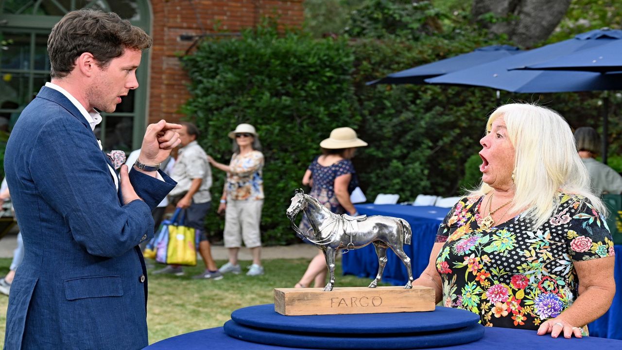 Antiques Roadshow appraiser David Walker discusses an item. (Photo courtesy of Katherine Nelson for GBH)