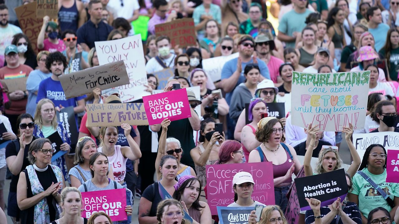 Abortion rights protesters attend a rally outside the state Capitol in Lansing, Mich., on June 24. (AP Photo/Paul Sancya, File)