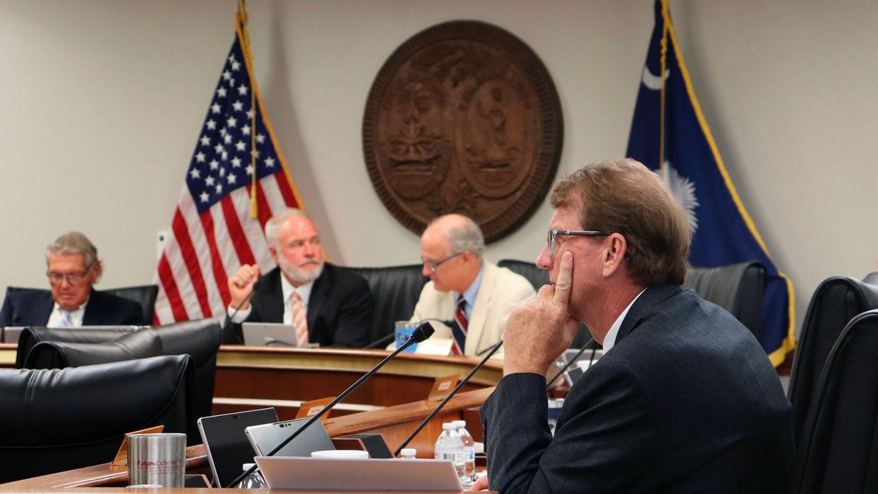 State Sen. Richard Cash, center, a leading supporter of South Carolina's recently implemented Fetal Heartbeat law banning abortion around six weeks, sits during a Senate Medical Affairs Committee meeting, Wednesday, Aug. 17, 2022, in Columbia, S.C. (AP Photo/James Pollard)