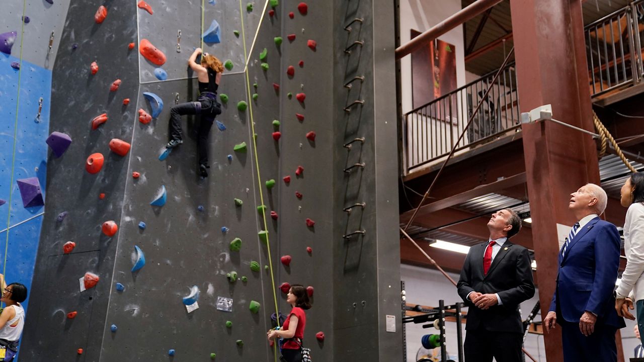 Biden and Northam appear at a rock-climbing gym in Alexandria, Va. (AP/Evan Vucci)