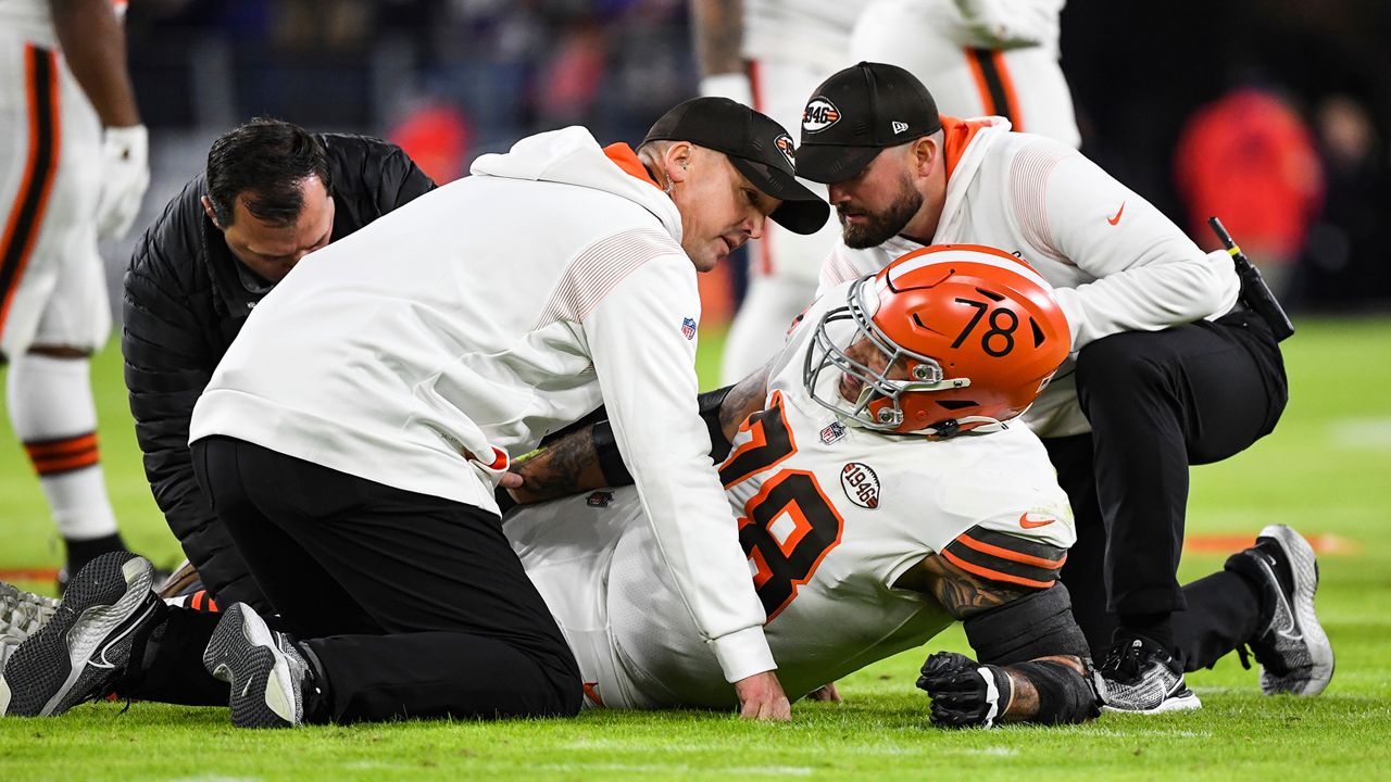 Cleveland Browns offensive tackle Jack Conklin (78) is removed from the game due to an apparent leg injury sustained during the first half of an NFL football game against the Baltimore Ravens, Sunday, Nov. 28, 2021, in Baltimore. (AP Photo/Terrance Williams)