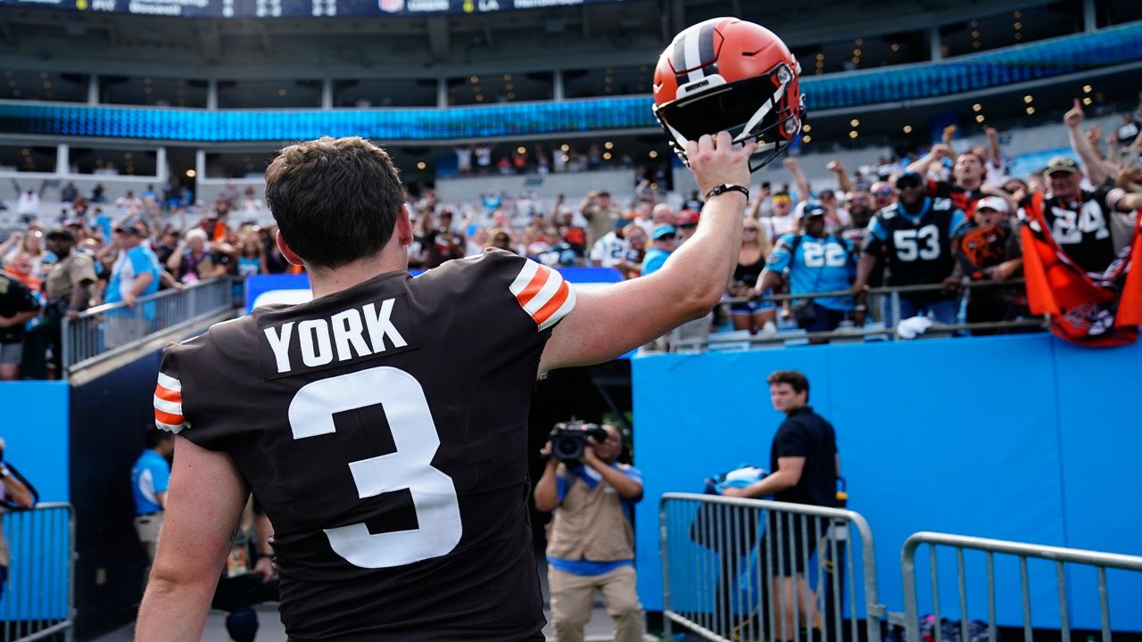 Cleveland Browns place kicker Cade York waves as he leaves the field after their win against the Carolina Panthers during an NFL football game on Sunday, Sept. 11, 2022, in Charlotte, N.C. York kicked the game winning field goal. (AP Photo/Jacob Kupferman)