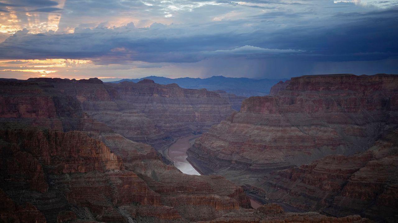 The Colorado River flows through the Grand Canyon on the Hualapai reservation Monday, Aug. 15, 2022, in northwestern Arizona. Six western states that rely on water from the Colorado River have agreed on a plan to dramatically cut their use. California, the state with the largest allocation of water from the river, is the holdout. (AP Photo/John Locher, File)