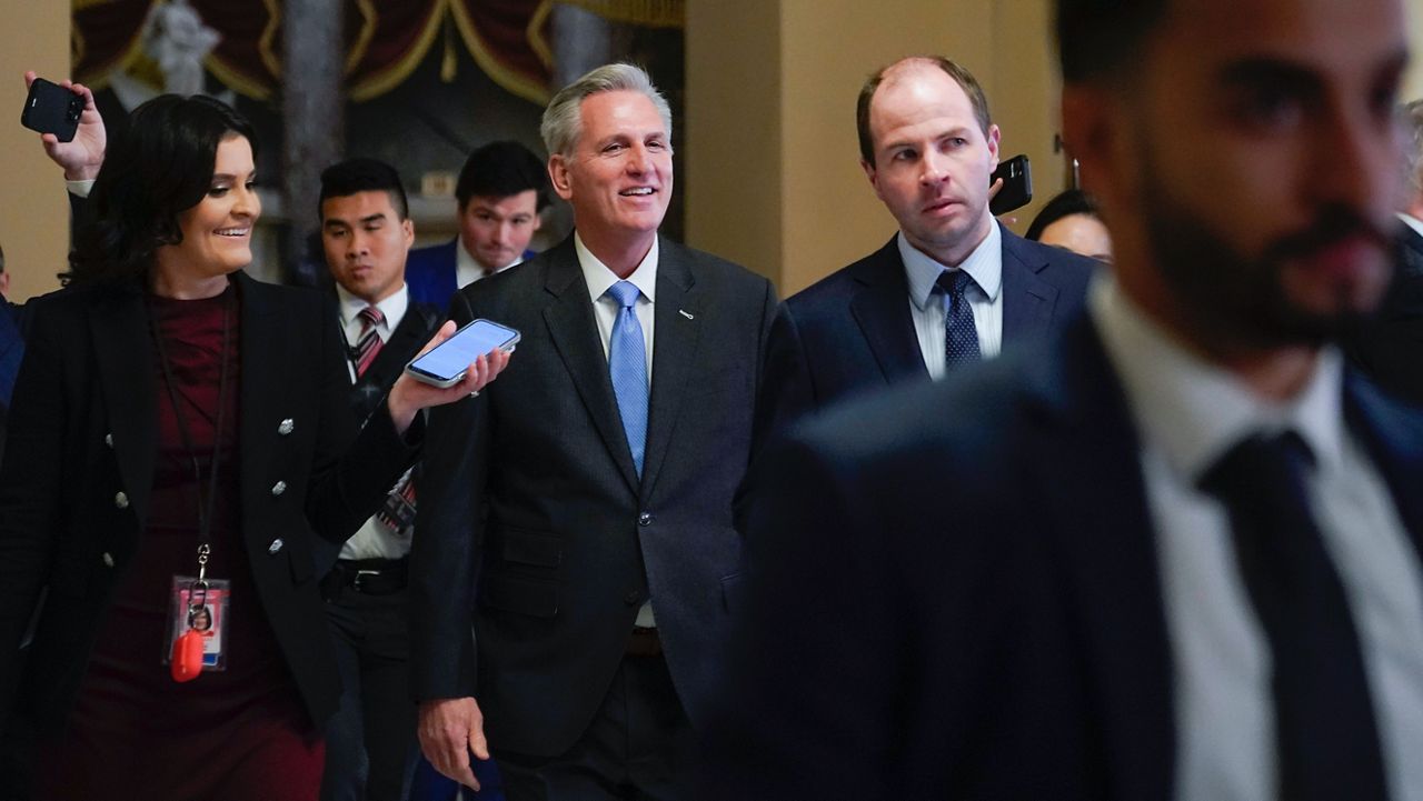 House Speaker Kevin McCarthy of Calif., speaks with members of the press as he walks to the House floor on Capitol Hill in Washington, Wednesday, Jan. 11, 2023. (AP Photo/Patrick Semansky)