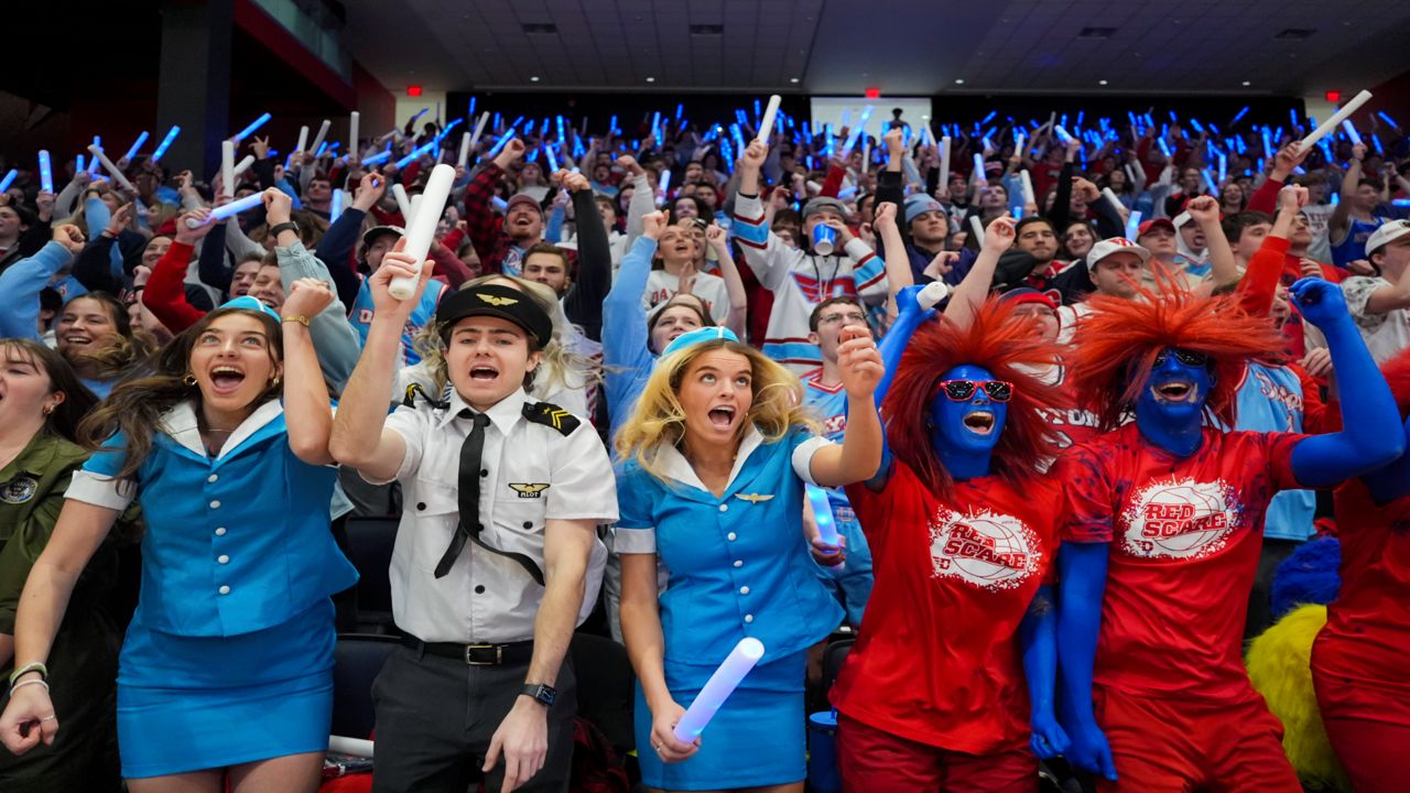 Students cheer before an NCAA college basketball game between Rhode Island and Dayton, Saturday, Jan. 20, 2024, in Dayton, Ohio. (AP Photo/Aaron Doster)