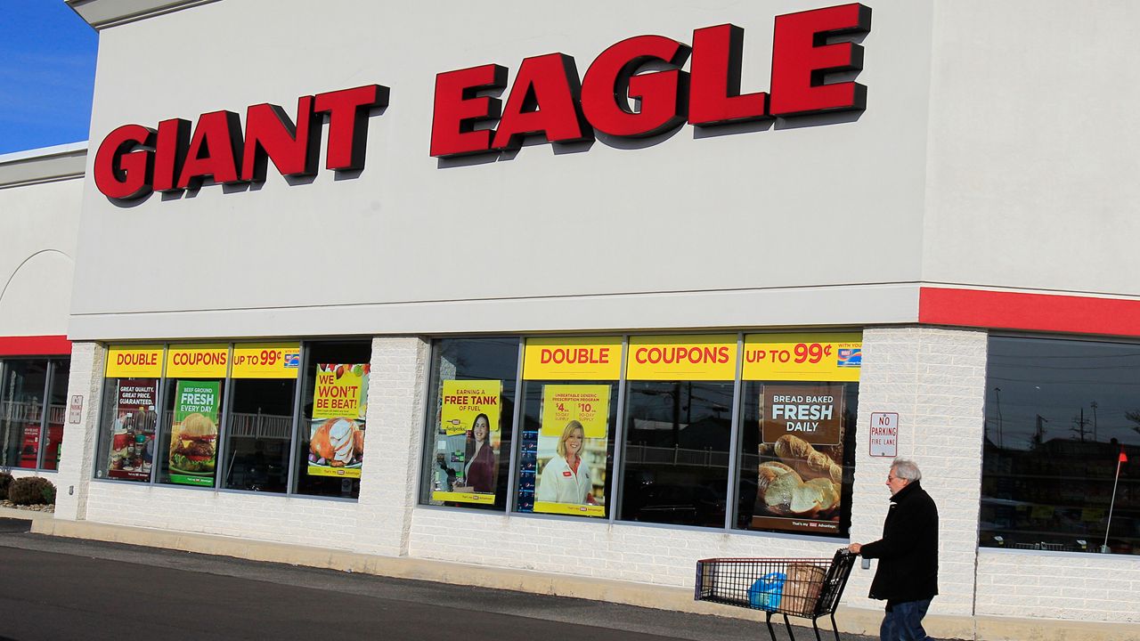 A man walks out of the Giant Eagle grocery store Thursday, Nov. 17, 2011, in Mayfield Heights, Ohio. (AP Photo/Tony Dejak)