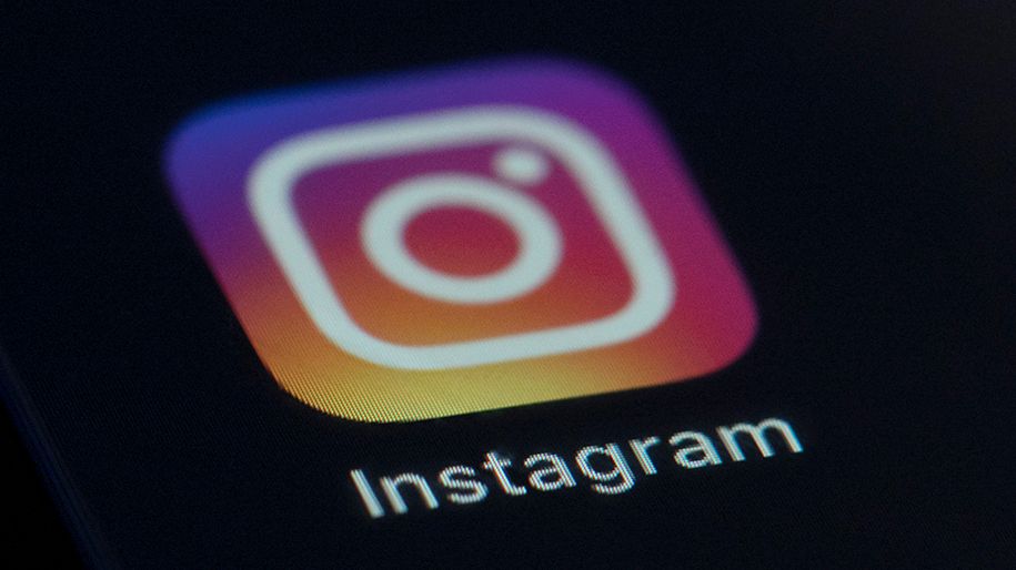 The Instagram app icon is seen on the screen of a mobile device. (AP Photo/Jenny Kane, File)