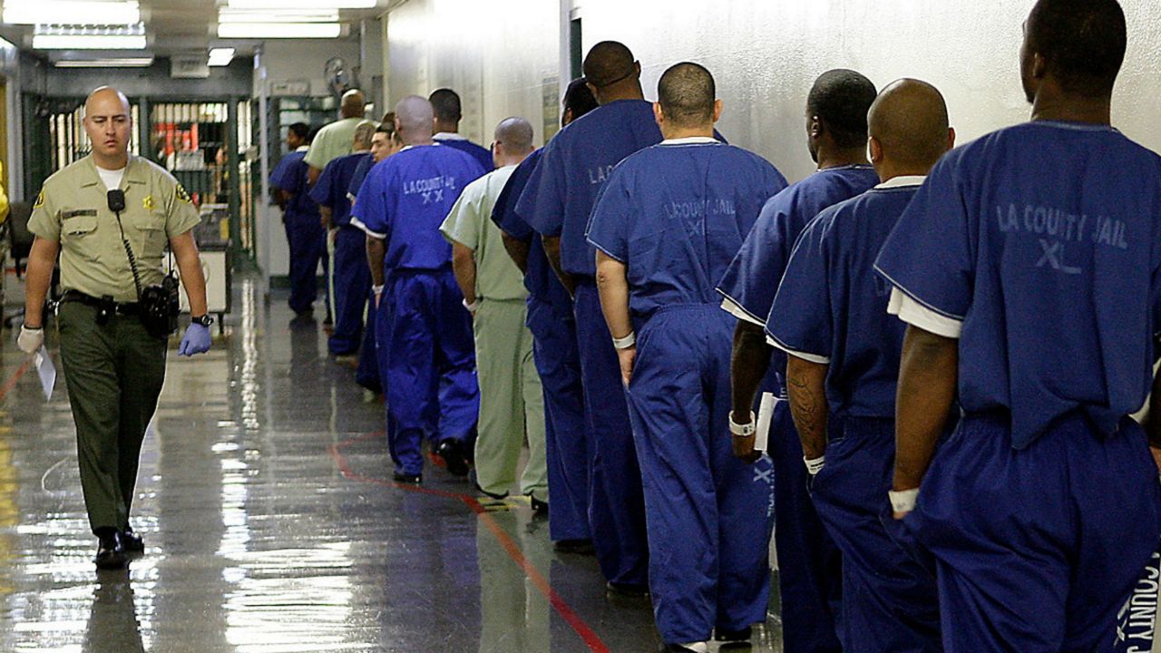 Prisoners are lined up in this file image. (Associated Press)