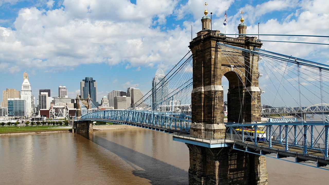 The Cincinnati skyline and John A. Roebling Suspension Bridge is seen from the banks of the Ohio River on Tuesday, Sept. 18, 2018, in Covington, Ky. (AP Photo/John Minchillo)