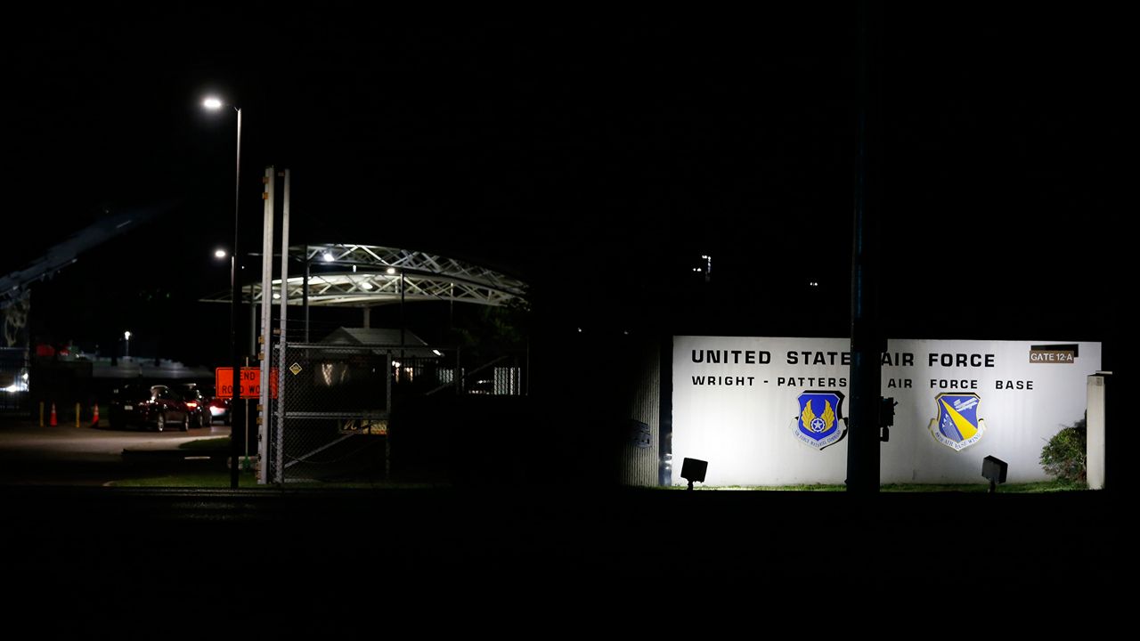 People wait in their cars outside the main gate of Wright-Patterson Air Force Base during a lockdown Friday, Sept. 10, 2021, in Dayton, Ohio. The base was put on lockdown due to a report of an active shooter but was later given the all clear. (AP Photo/Jay LaPrete)