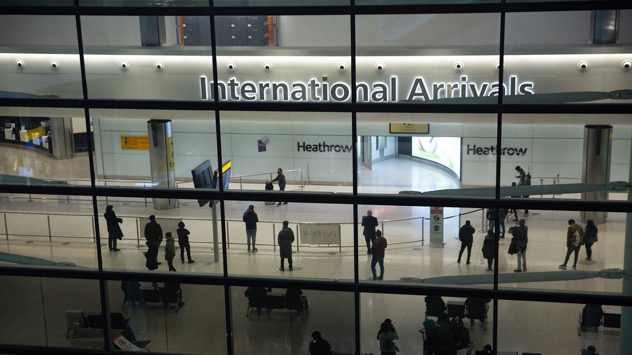 People in the arrivals area at Heathrow Airport in London, Jan. 26, 2021, during England's coronavirus lockdown. (AP Photo/Matt Dunham, File)