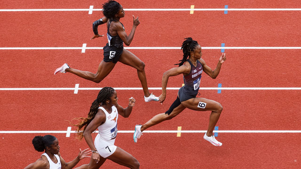 Runners compete in a preliminary heat of the women's 200 meters during the NCAA Division I Outdoor Track and Field Championships, Thursday, June 10, 2021, at Hayward Field in Eugene, Ore. Leading is Ohio State's Anavia Battle. (AP Photo/Thomas Boyd)