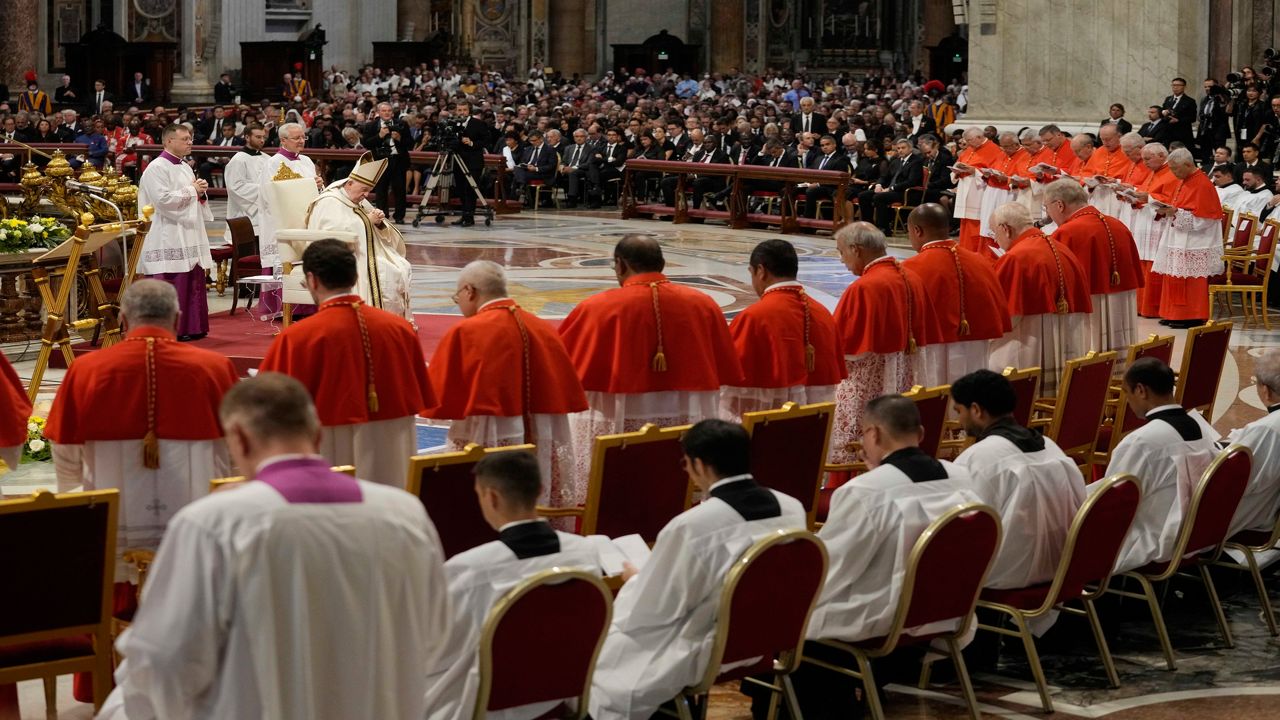 Pope Francis prays in front of new Cardinals during consistory inside St. Peter's Basilica, at the Vatican, Saturday, Aug. 27, 2022. Pope Francis has chosen 20 men to become the Catholic Church's newest cardinals. (AP Photo/Andrew Medichini)