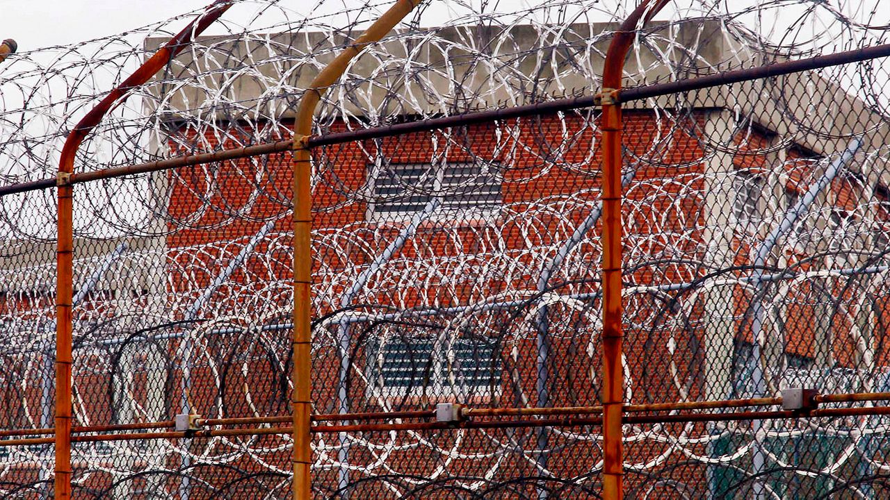 A security fence surrounds inmate housing at the Rikers Island correctional facility in New York in 2011.