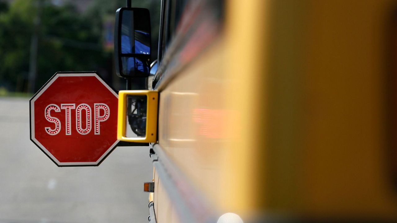 A Concord police officer was caught on camera passing a stopped school bus as a student was getting off the bus last week, the Concord Police Department says.