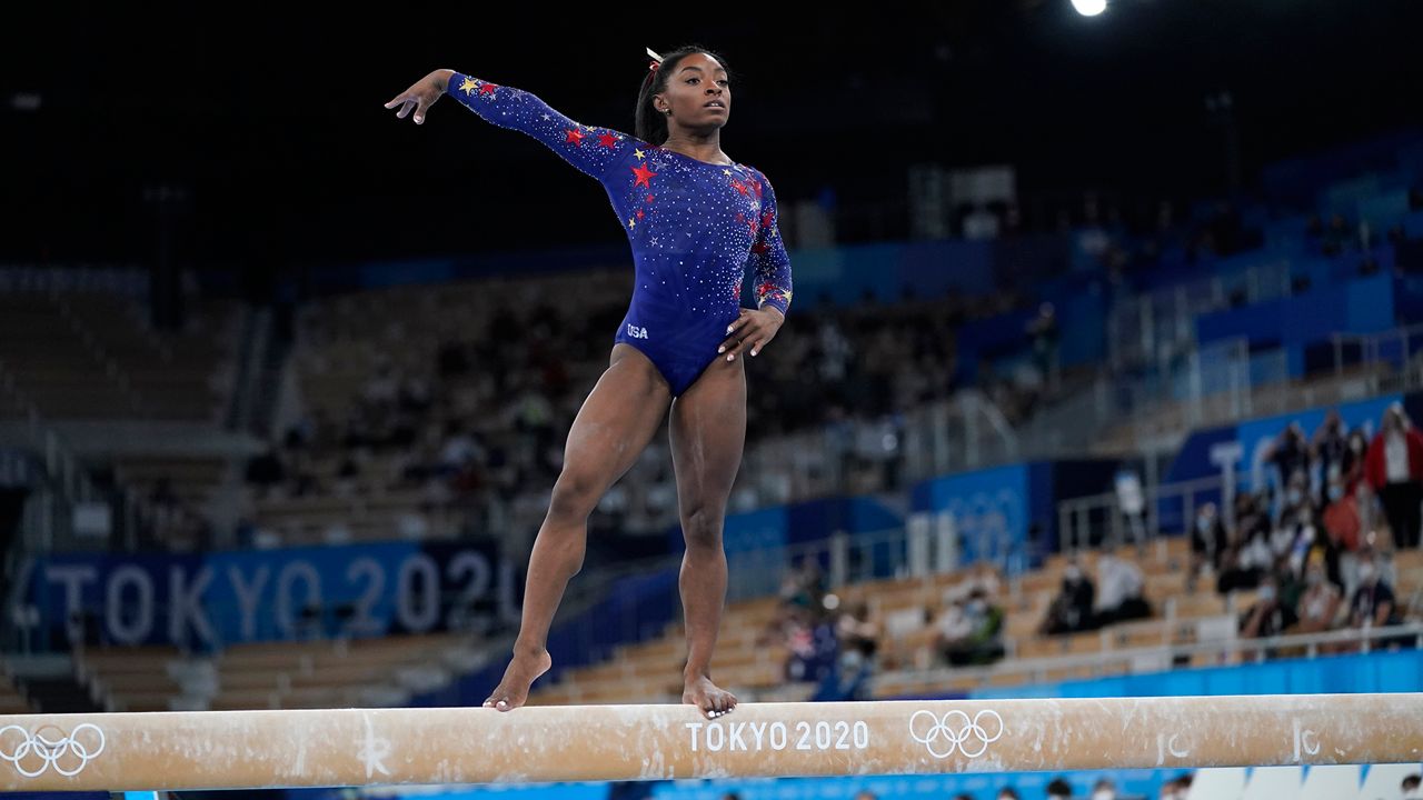 Simone Biles leaps into action at the KFC Yum! Center SPORTS Olympic torch begins journey across France after festive welcome in port city of Marseille