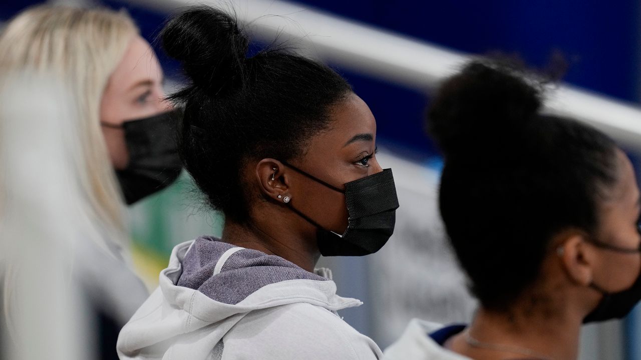 United States gymnast Simone Biles sits on the stands during the artistic gymnastics women's all-around final at the 2020 Summer Olympics, Thursday, July 29, 2021, in Tokyo, Japan. (AP Photo/Natacha Pisarenko)
