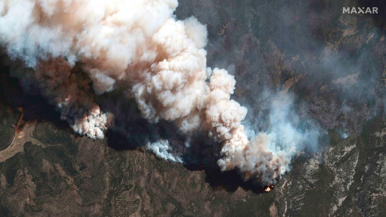 More than 5,000 firefighters are battling multiple wildland blazes in dry, windy weather across the Southwest. Evacuation orders remained in place Thursday, May 19, 2022, for residents near fires in Texas, Colorado and New Mexico. (Satellite image ©2022 Maxar Technologies via AP, File)