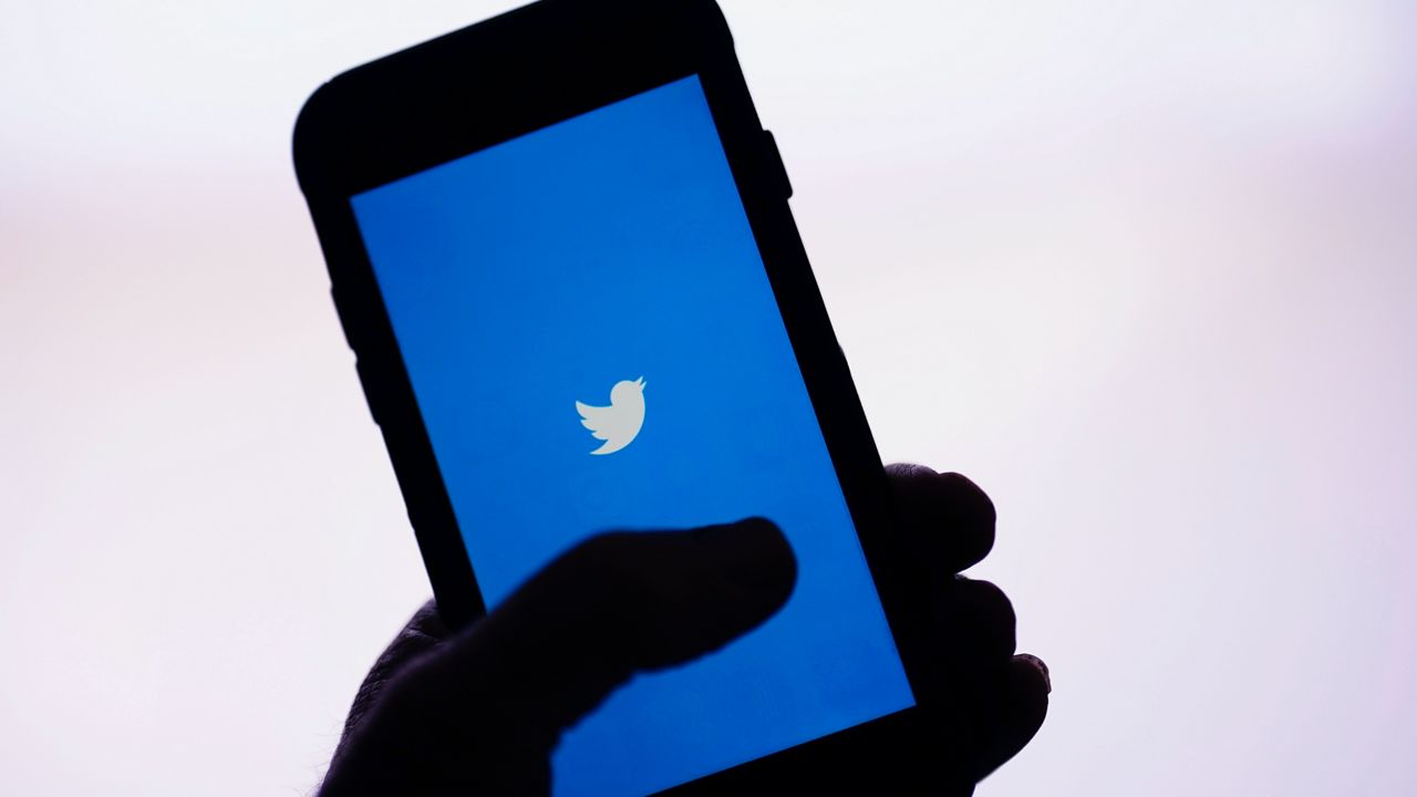 The Twitter app is seen on a smartphone (AP Photo/Gregory Bull, File)