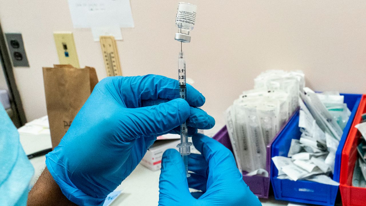 A COVID-19 vaccine injection is prepared in this file image. (Associated Press)