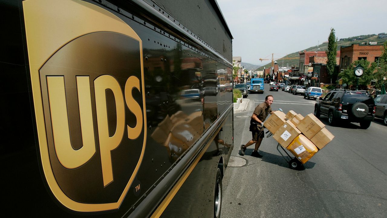 A UPS driver delivers packages in Park City, Utah in this July 18, 2006 file photo. (AP Photo/Douglas C. Pizac, file)