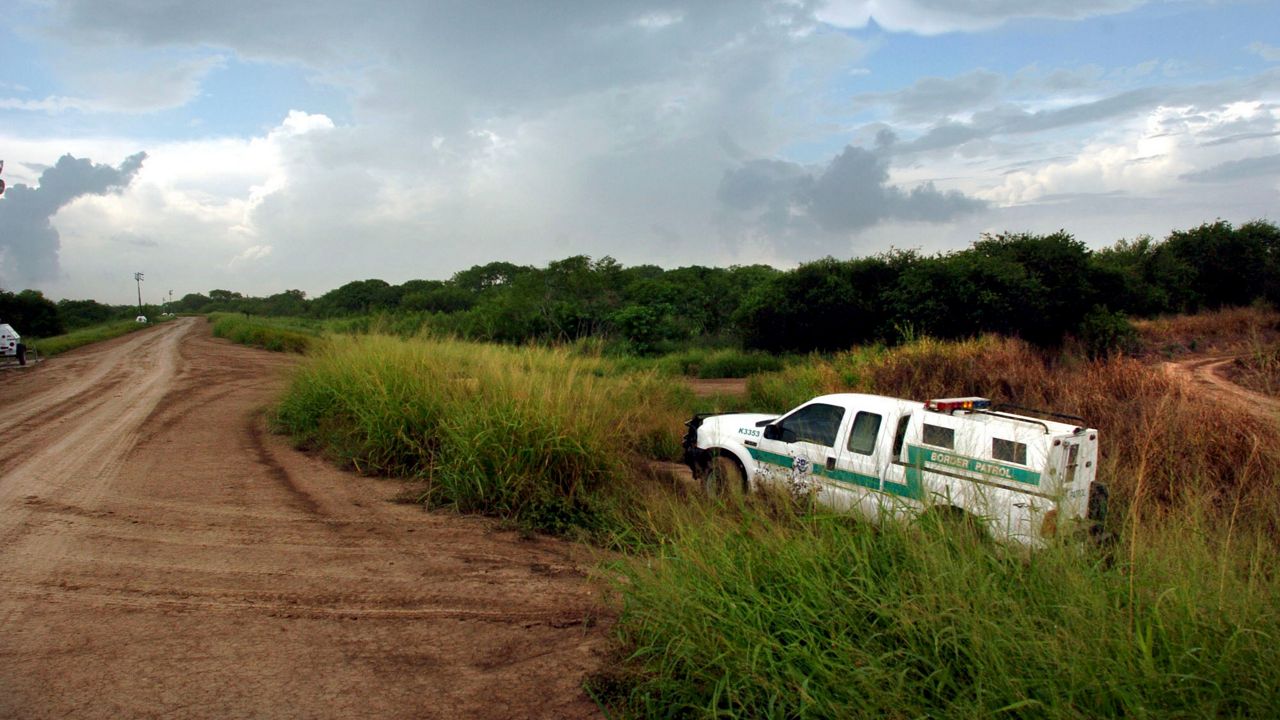 A U.S. Border Patrol vehicle drives upon the river levee, Tuesday, Aug. 8, 2006 near the Rio Grande north of Brownsville, Texas. (AP Photo/Brad Doherty)