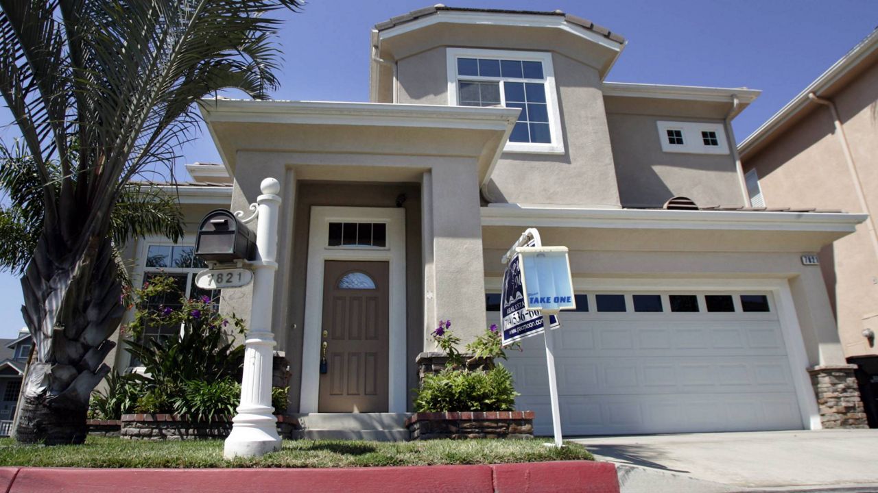 A home listed as being in foreclosure on the California Housing and Urban Development website is seen in Huntington Beach, Calif., Aug. 15, 2007. (AP Photo/Reed Saxon)