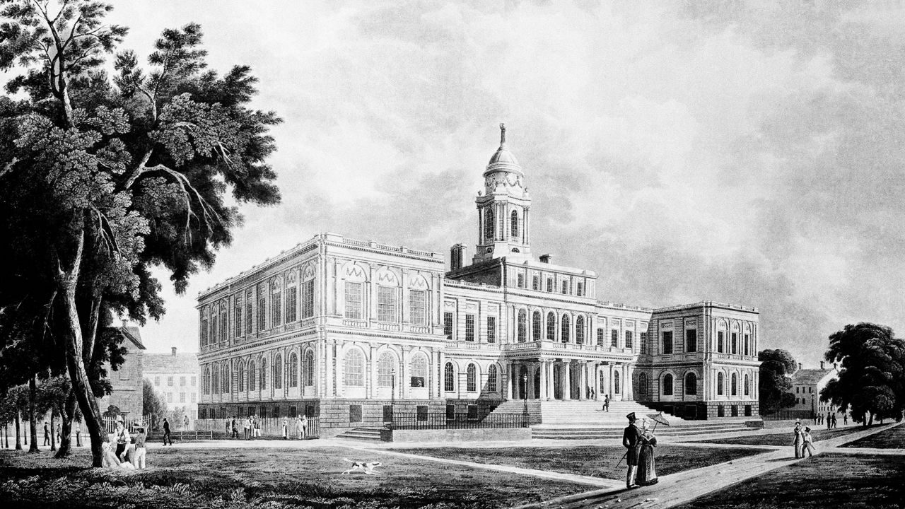 Black and white photo of a City Hall illustration from 1825 showing the exterior with trees to the left and people walking along the path in the front of the building.