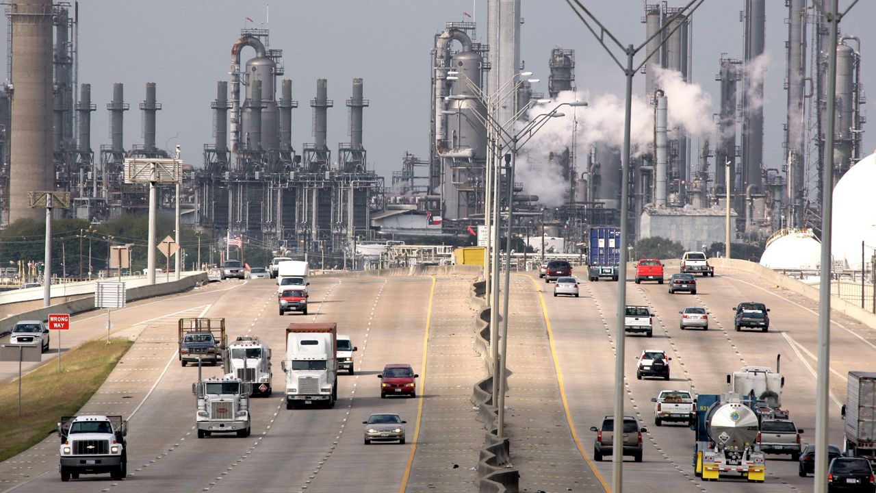 Shell Oil Company's Deer Park refinery and petrochemical facility is shown in the background as vehicles travel along Highway 225 Wednesday, Nov. 21, 2007 in Deer Park, Texas. (Associated Press)