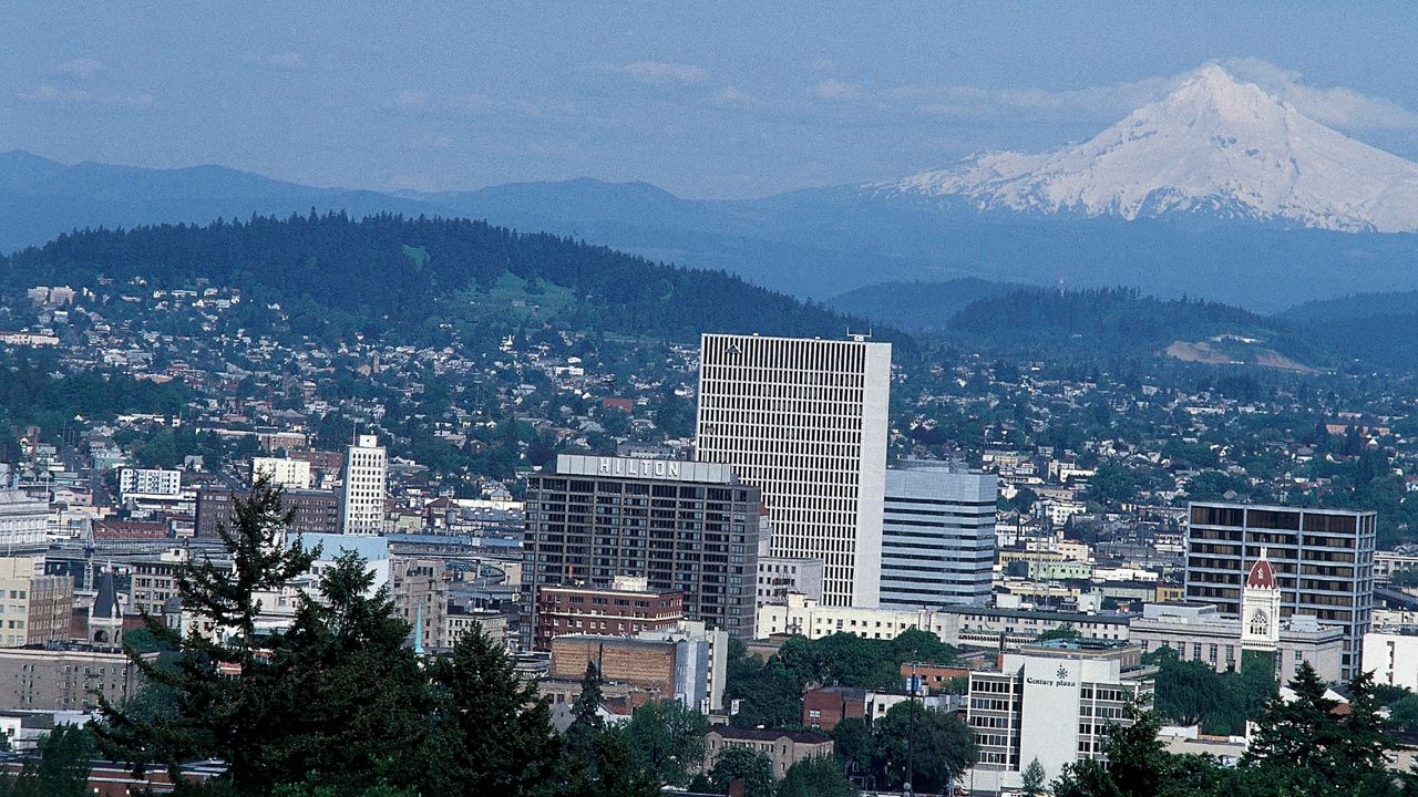 General view of Oregon's largest city, Portland, with Mt. Hood in the background. (AP Photo)
